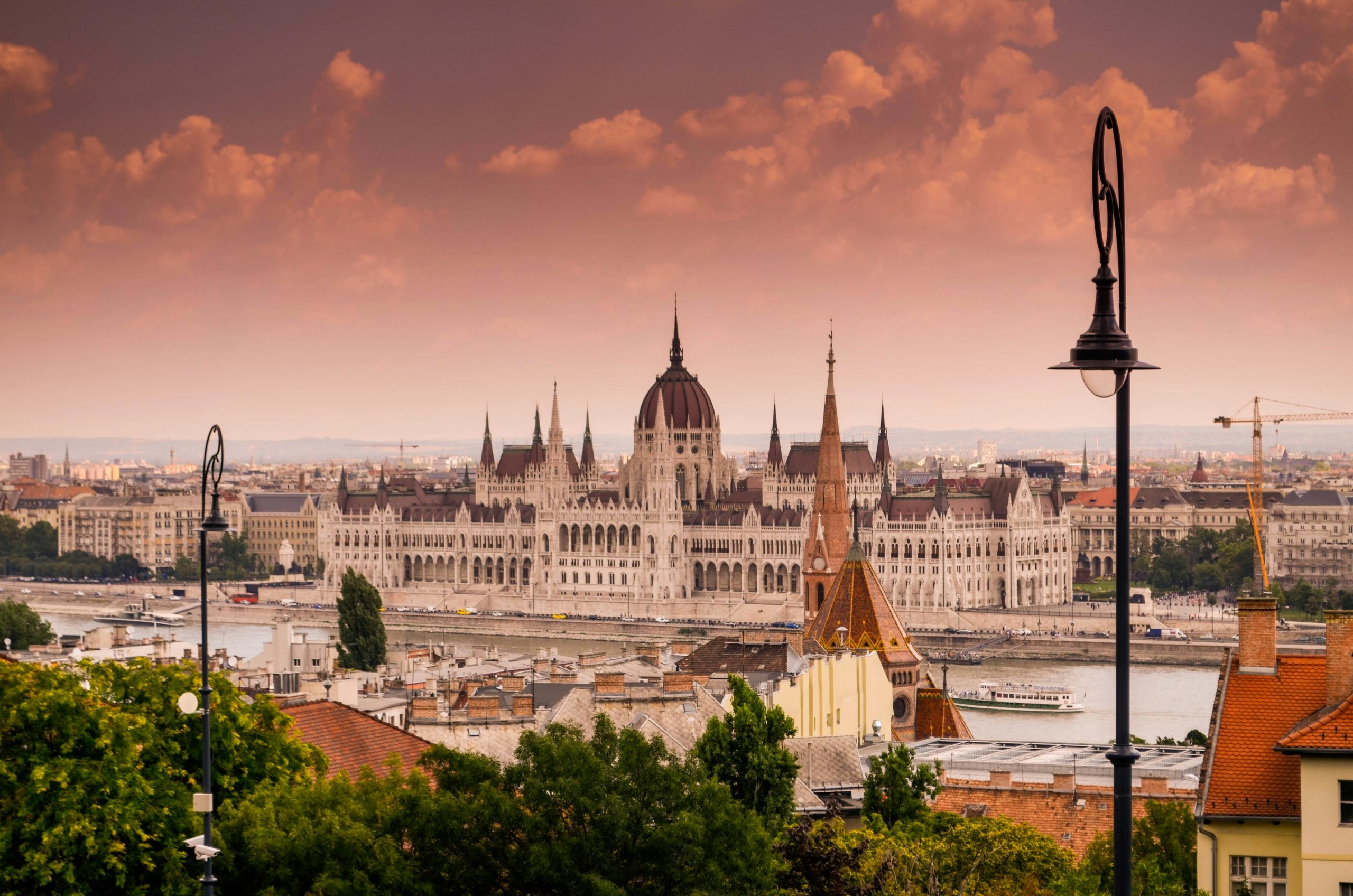 Budapest city skyline with Hungarian Parliament and Danube River at sunset